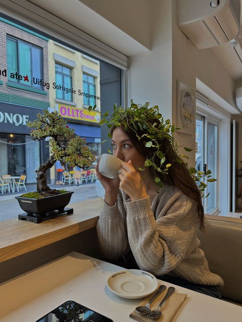 A bonsai crown at brunch — original AI-generated fictional character
